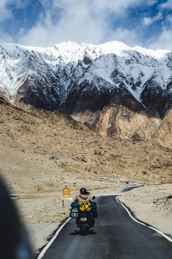 motorcycle solo ride empty road mountains before rally