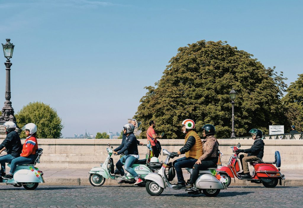 vespa riders on asphalt road - white-and-black-motor-scooter-m13y_H6HkYc